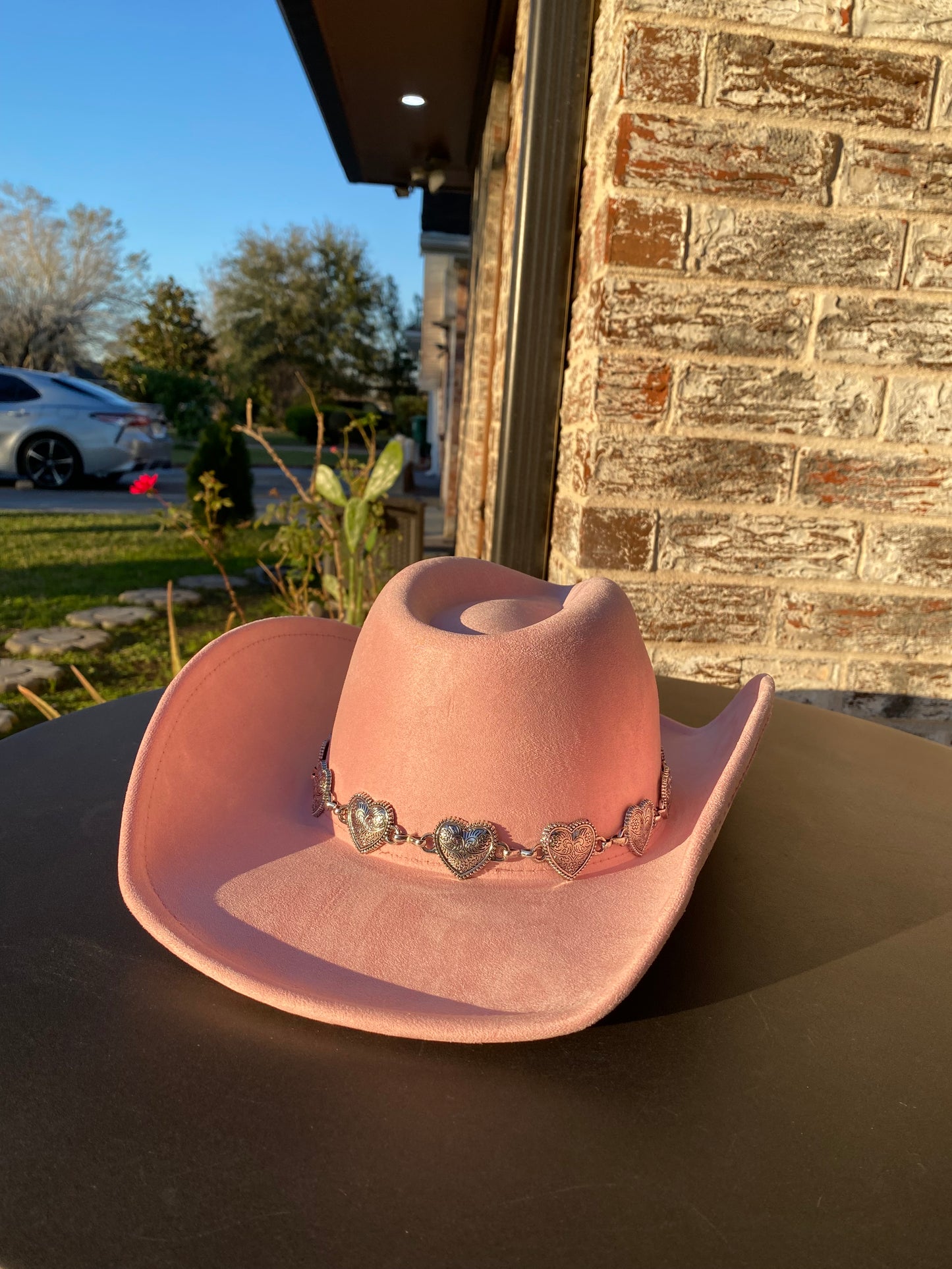 Pink cowgirl hat with metallic hearts