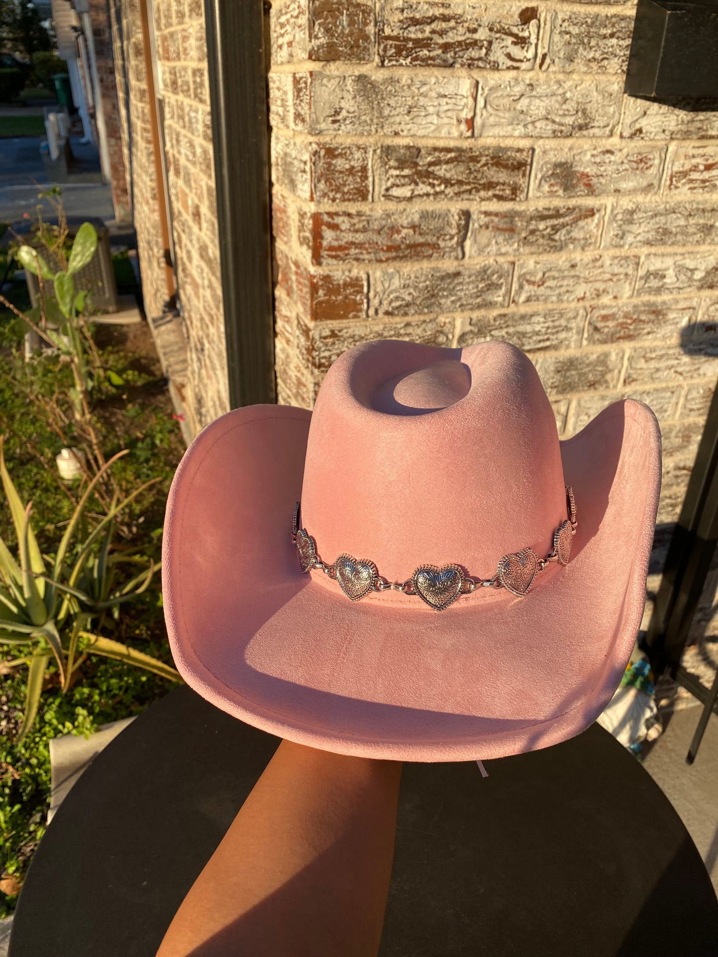 Pink cowgirl hat with metallic hearts