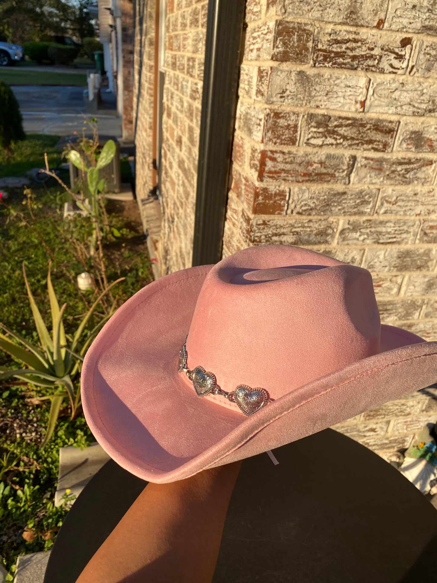 Pink cowgirl hat with metallic hearts