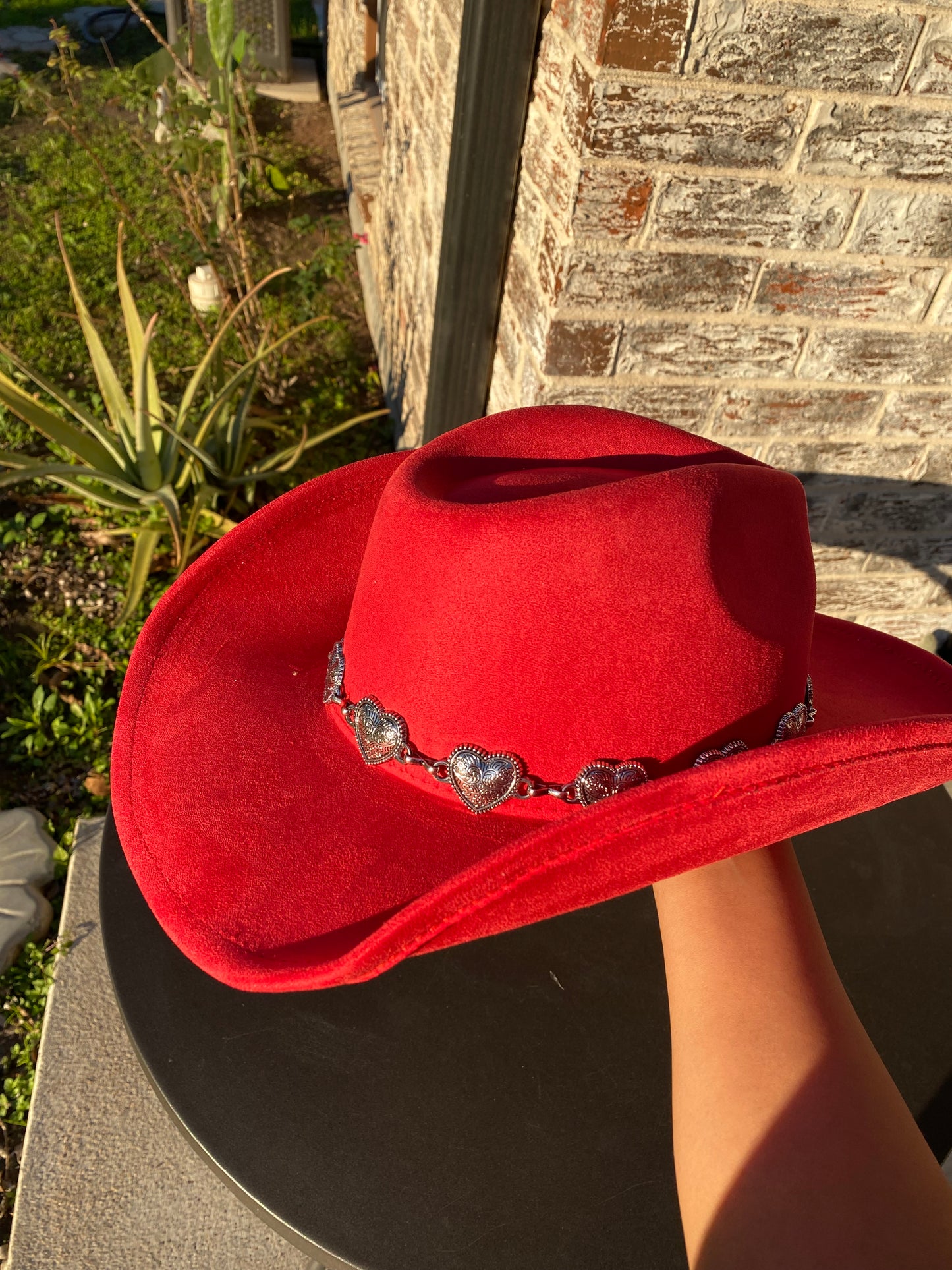 Red cowgirl hat with metallic hearts