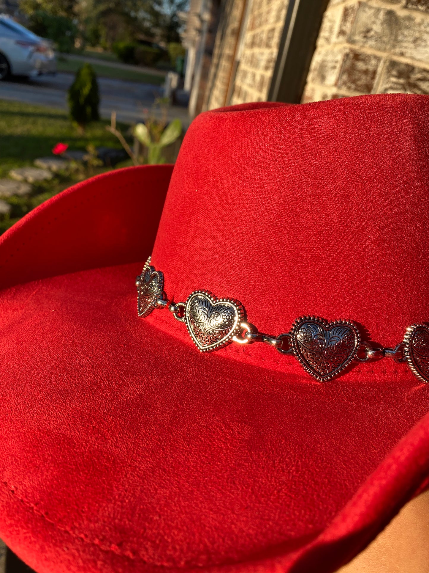 Red cowgirl hat with metallic hearts